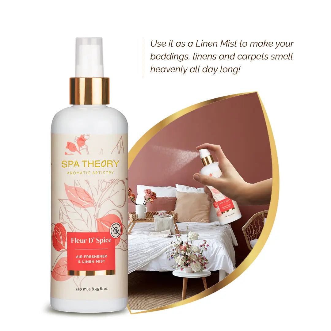 Bottle of "Spa Theory" linen mist with floral design. Hand sprays mist over cozy, decorated bed. Text highlights its use for freshening linens.