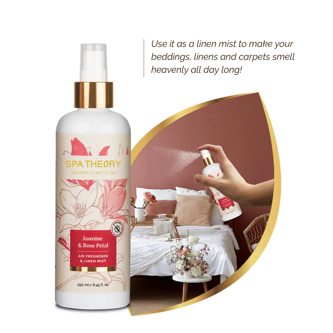 Bottle of Spa Theory Jasmine & Rose Petal linen mist. Background shows a hand spraying mist over a cozy bed with cushions and flowers.