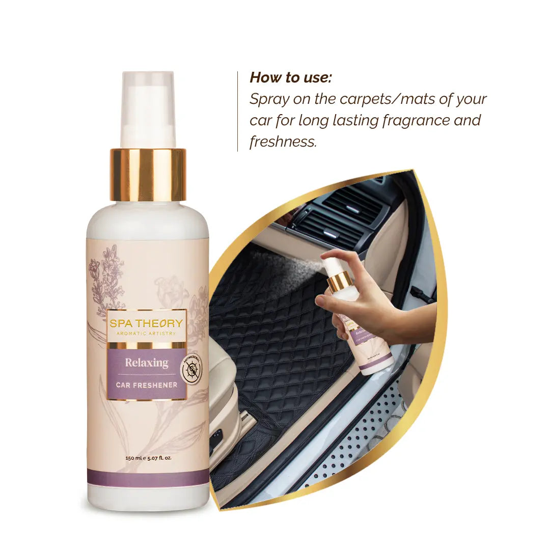 "SPA THEORY Relaxing Car Freshener bottle with lavender design next to a hand spraying it on a car mat