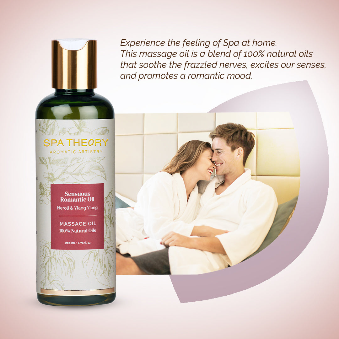 Bottle of "Spa Theory" Romantic Massage Oil with floral design on the label. Beside it, a smiling couple in robes share a tender moment, suggesting relaxation and intimacy.
